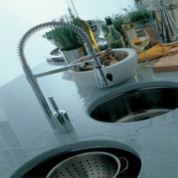 Pull-out spray kitchen mixer tap over a granite worktop